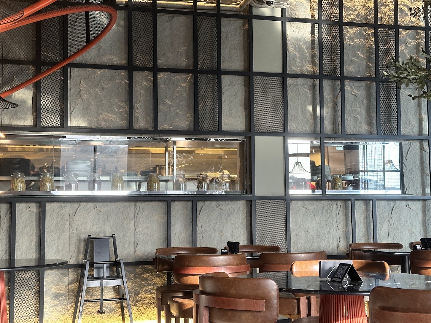 Warm chairs and open-kitchen views