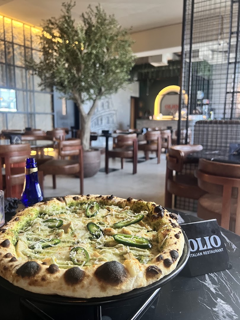 Photo shows pizza at Olio; dish photography is not available.